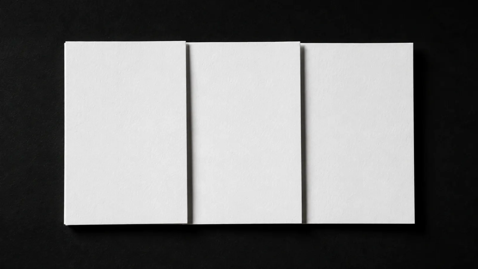 Three blank index cards laid out in a row